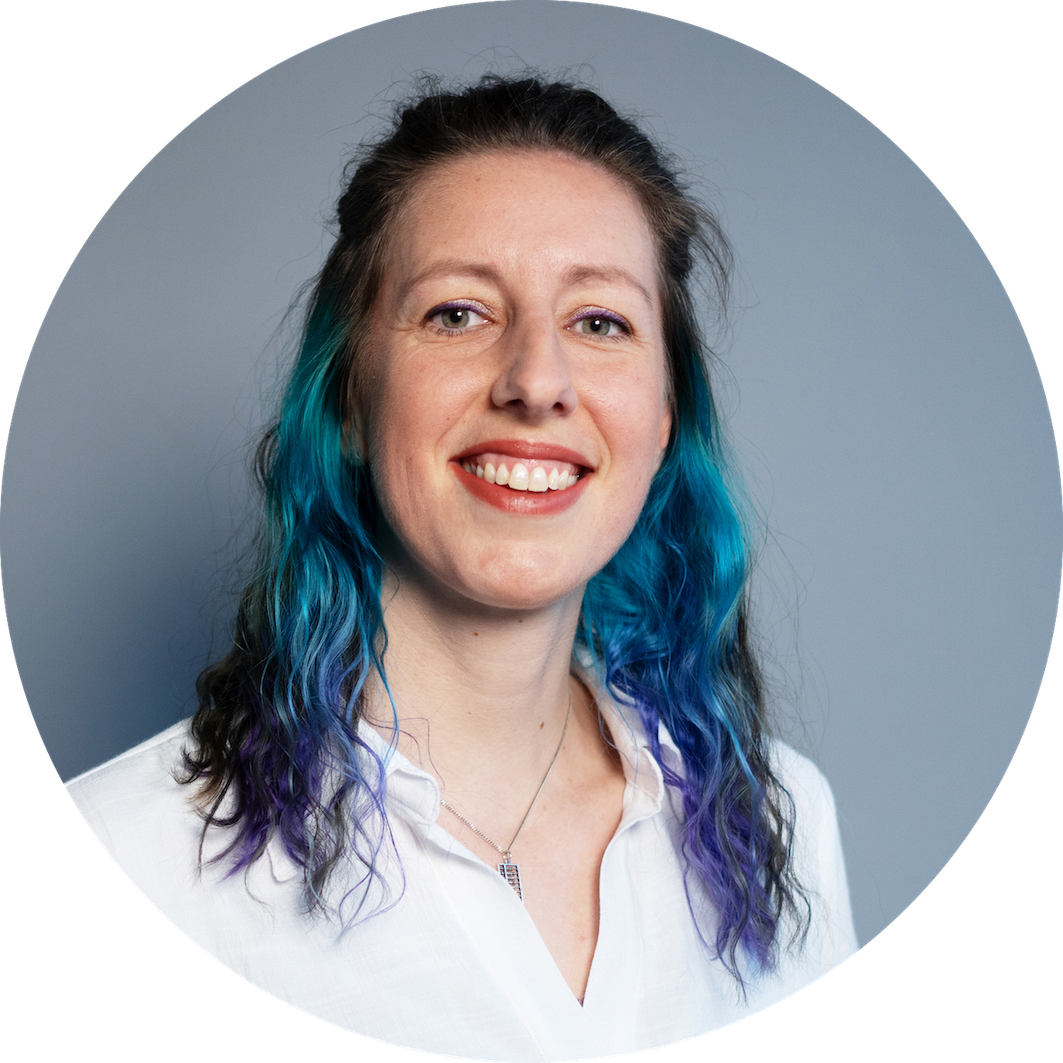 Smiling woman with teal and purple hair